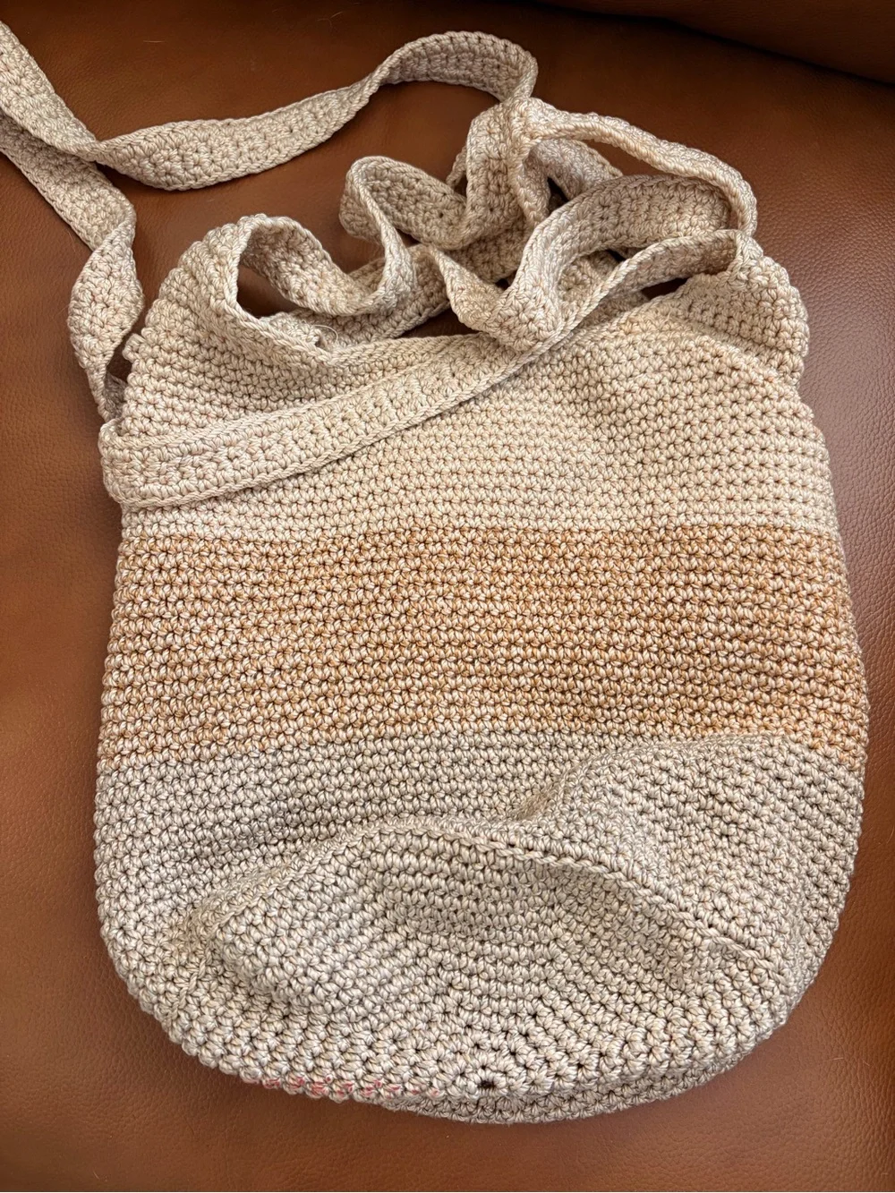 The Sak Silver Round Logo Tag on Cream Braided Accent